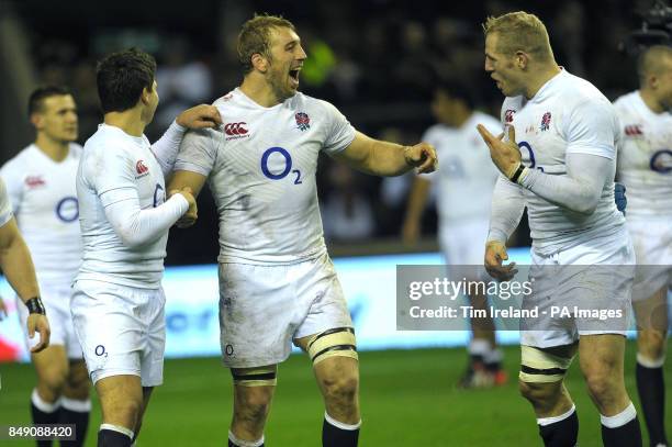 England's Chris Robshaw celebrates with Ben youngs and James Haskell following the QBE International at Twickenham Stadium, London.
