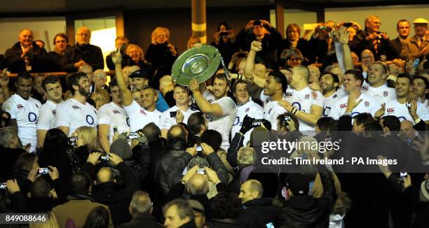 England's Captain Chris Robshaw celebrates winning the Hilary Shield with the England squad during the QBE International at Twickenham Stadium,...