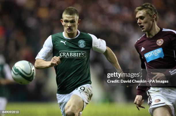 Hibernian's Ross Caldwell holds off Hearts Kevin McHattie during the Scottish Cup Fourth Round match at Easter Road, Edinburgh.