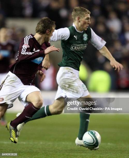 Hibernian's David Witherspoon holds off Hearts Scott Robinson during the Scottish Cup Fourth Round match at Easter Road, Edinburgh.