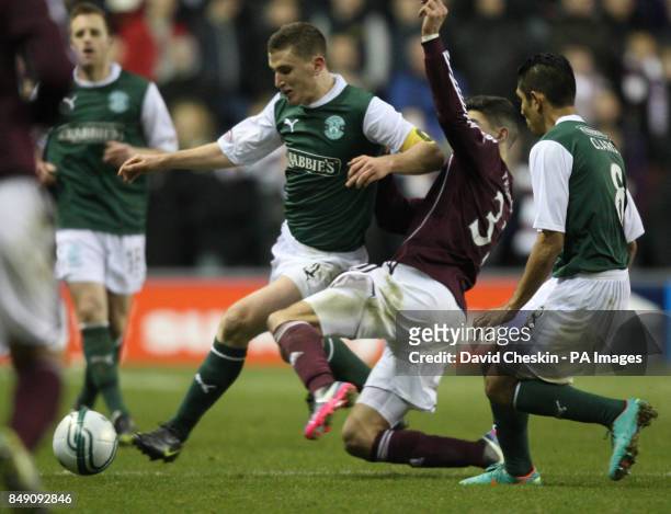 Hibernian's Paul Hanlon holds off Hearts Callum Paterson during the Scottish Cup Fourth Round match at Easter Road, Edinburgh.