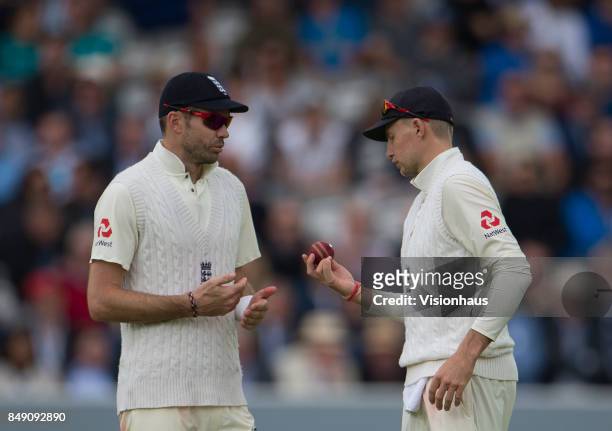 James Anderson and Joe Root of England during Day One of the 3rd Investec Test Match between England and West Indies at Lord's Cricket Ground on...
