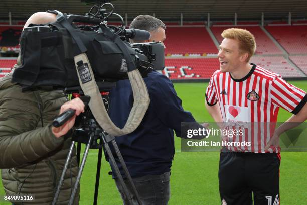 Duncan Watmore of Sunderland AFC displaying the Bradley Lowery Foundation shirts to worn in the up coming Carabao cup match on September 18, 2017 in...