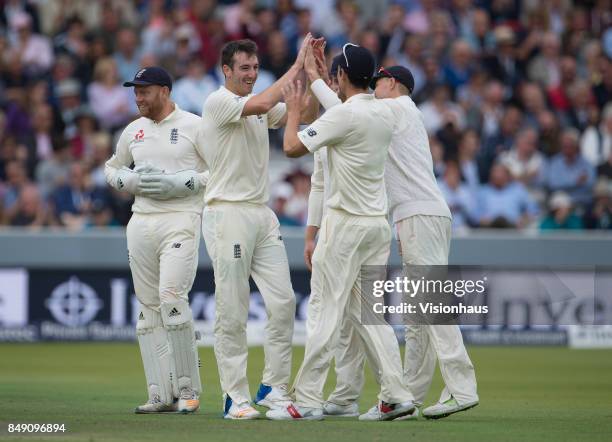 Toby Roland-Jones of England celebrates taking the wicket of Jermaine Blackwood during Day One of the 3rd Investec Test Match between England and...