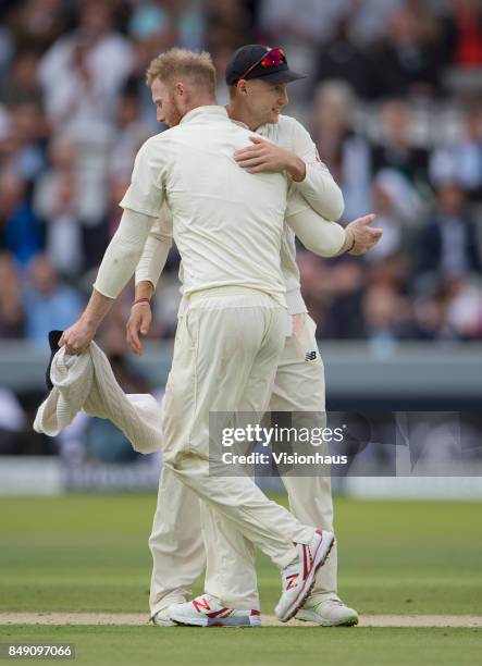 Ben Stokes of England is embraced by Captain Joe Root after taking six West Indies wickets during Day One of the 3rd Investec Test Match between...