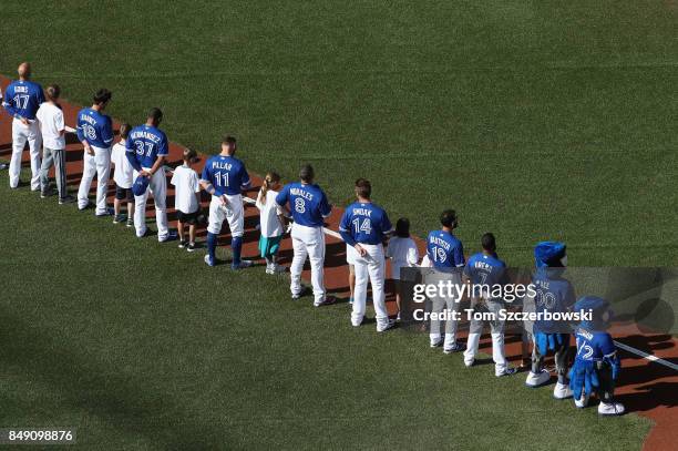 Ryan Goins of the Toronto Blue Jays and Darwin Barney and Teoscar Hernandez and Kevin Pillar and Kendrys Morales and Justin Smoak and Jose Bautista...