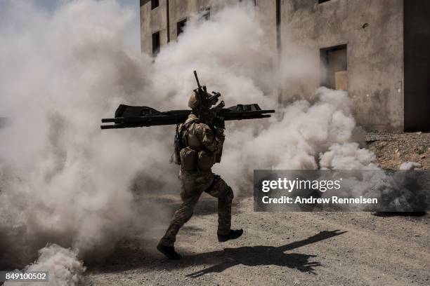 Members of Afghanistan's Crisis Response Unit 222, an Afghan Special Police Unit, participate in a training slowed down for the media on September 7,...