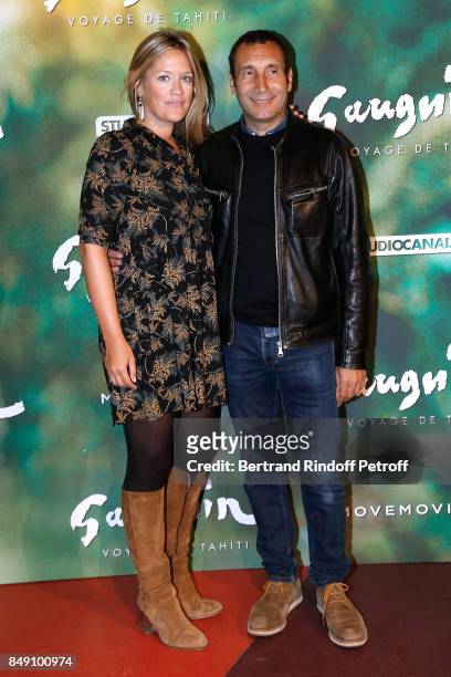 Painter Caroline Faindt and her companion actor Zinedine Soualem attend the "Gauguin, Voyage de Tahiti" Paris Premiere at Cinema Gaumont Capucine on...