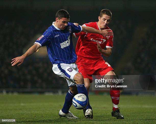 Jon Walters of Ipswich Town holds back Chris Cohen of Nottingham Forest during the Coca Cola Championship match between Ipswich Town and Nottingham...