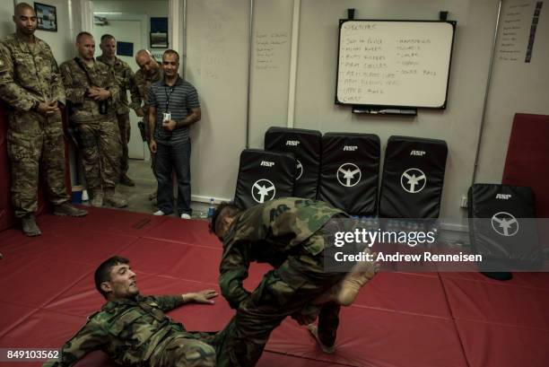 Members of the Afghanistan Air Force demonstrate fighting tactics taught to them by U.S. Air Force advisors on September 9, 2017 at Kandahar Air...