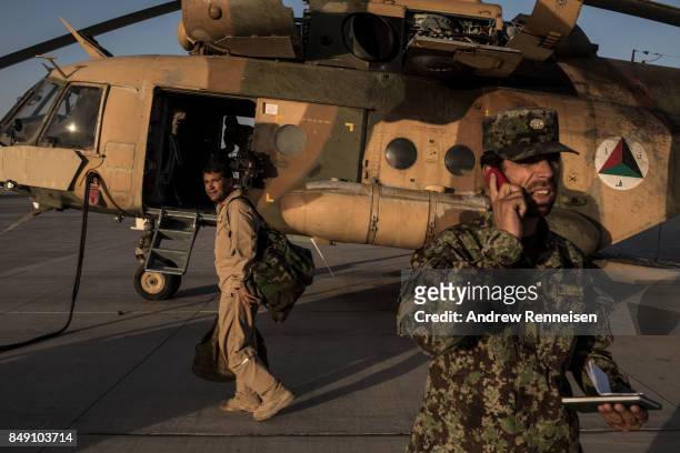 Members of the Afghanistan Air Force prepare a Mi-17 helicopter for a flight on September 9, 2017 at Kandahar Air Field in Kandahar, Afghanistan....