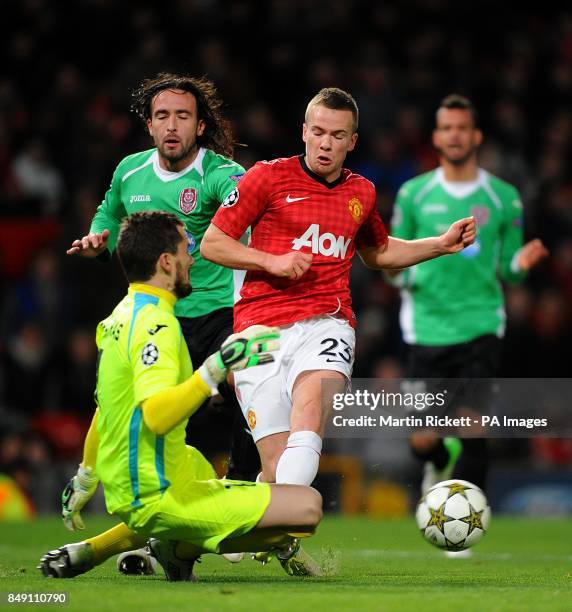 Cluj Napoca goalkeeper Jorge Mario Felgueiras makes a save from Manchester United's Tom Cleverley
