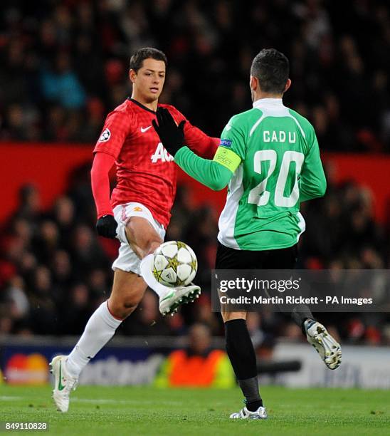 Manchester United's Javier Hernandez and CFR Cluj-Napoca's Ricardo Cadu battle for the ball