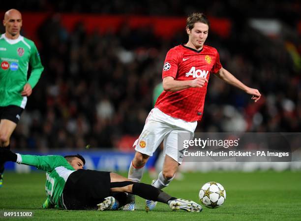 Manchester United's Nick Powell is challenged by CFR Cluj-Napoca's Ricardo Cadu