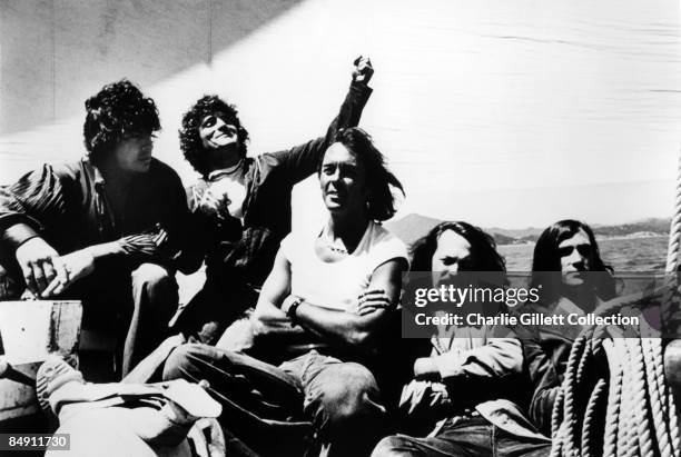 Portrait of American Psychedelic Rock group Quicksilver Messenger Service on the deck of a sailboat, circa 1970. Pictured are, from left, Dino...