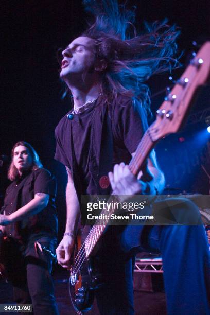 Photo of BLACK STONE CHERRY and Jon LAWHON and Chris ROBERTSON; Chris Robertson and Jon Lawhon performing on stage,