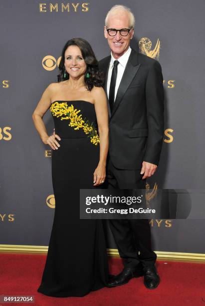 Julia Louis-Dreyfus and husband Brad Hall arrive at the 69th Annual Primetime Emmy Awards at Microsoft Theater on September 17, 2017 in Los Angeles,...