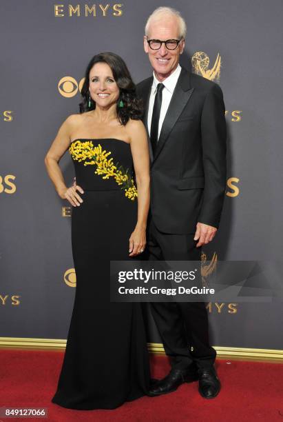 Julia Louis-Dreyfus and husband Brad Hall arrive at the 69th Annual Primetime Emmy Awards at Microsoft Theater on September 17, 2017 in Los Angeles,...