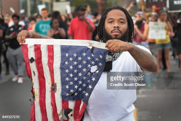 Demonstrators protesting the acquittal of former St. Louis police officer Jason Stockley march on September 17, 2017 in St. Louis, Missouri. This is...