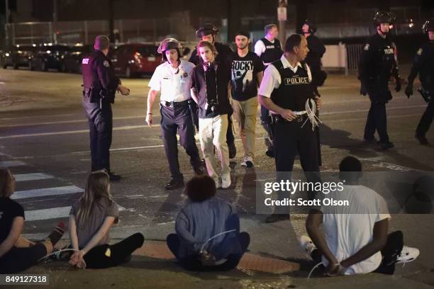 Police arrest demonstrators who were protesting the acquittal of former St. Louis police officer Jason Stockley on September 17, 2017 in St. Louis,...