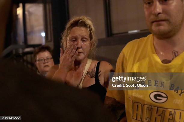 Woman's face is covered with mace sprayed by police during a protest of the acquittal of former St. Louis police officer Jason Stockley on September...