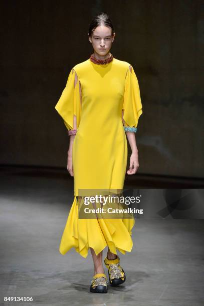 Model walks the runway at the Christopher Kane Spring Summer 2018 fashion show during London Fashion Week on September 18, 2017 in London, United...