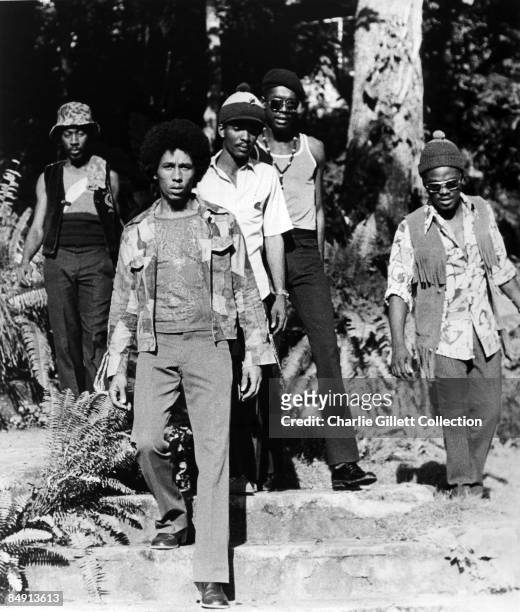 Photo of WAILERS and Bob MARLEY; L-R: Bunny Wailer, Bob Marley, Carlton Barrett, Peter Tosh, Aston 'Family Man' Barrett - The Wailers - posed, group...