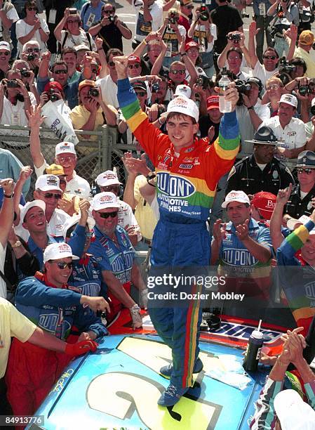 Driver Jeff Gordon celebrates in Victory Lane after winning the Brickyard 400 race on August 6, 1994 at the Indianapolis Motor Speedway in Speedway,...