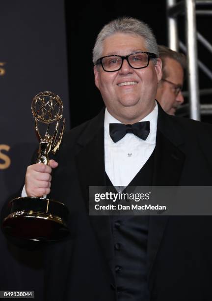 David Mandel poses in the press room with his Emmy award for Outstanding Comedy Series at the 69th Annual Primetime Emmy Awards at Microsoft Theater...