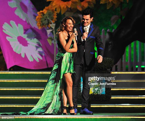 Kylie Minogue and Mathew Horne appears on stage at the Brit Awards 2009 at Earls Court on February 18, 2009 in London, England.