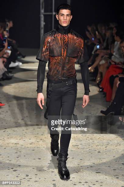 Model walks the runway at the Julien Macdonald Spring Summer 2018 fashion show during London Fashion Week on September 18, 2017 in London, United...