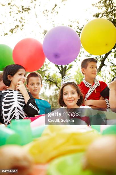 kids having a garden party, wearing costumes - boy tiara stock pictures, royalty-free photos & images