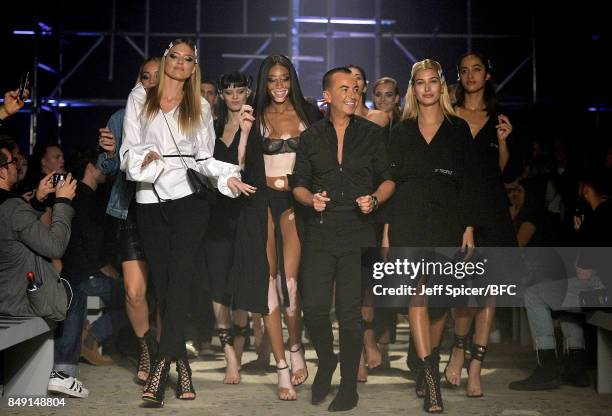 Martha Hunt Winnie, Harlow, Julien Macdonald and Hailey Baldwin on the runway during the rehearsal for the Julien Macdonald show during London...