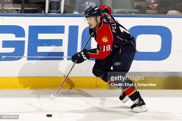 Ville Peltonen of the Florida Panthers skates with the puck against the New Jersey Devils at the Bank Atlantic Center on February 17, 2009 in...