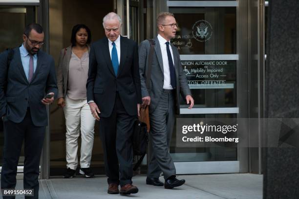 Mark Johnson, former head of global foreign exchange for HSBC Holdings Plc, right, exits federal court in the Brooklyn borough of New York, U.S., on...