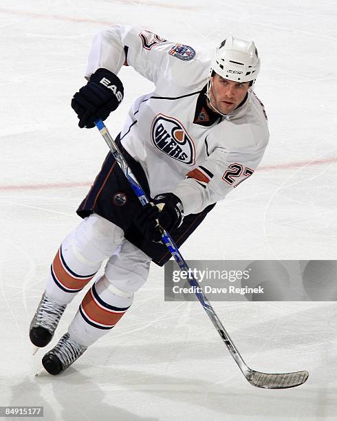 Dustin Penner of the Edmonton Oilers skates up ice during a NHL game against the Detroit Red Wings on February 7, 2009 at Joe Louis Arena in Detroit,...