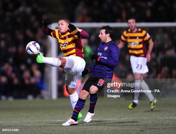 Bradford City's Nathan Doyle and Arsenal's Santi Cazorla battle for the ball