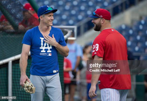 Chase Utley of the Los Angeles Dodgers talks to Cameron Rupp of the Philadelphia Phillies prior to the game at Citizens Bank Park on September 18,...