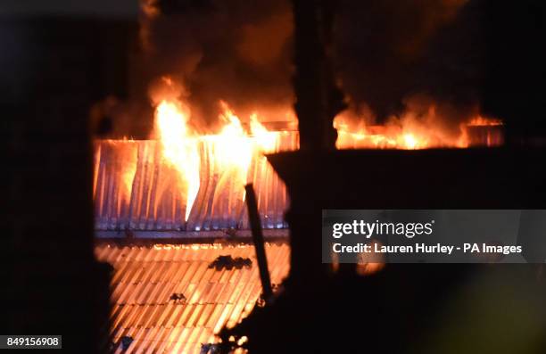 Emergency services at the scene as firefighters are battling a warehouse blaze on White Hart Lane in Tottenham, London.