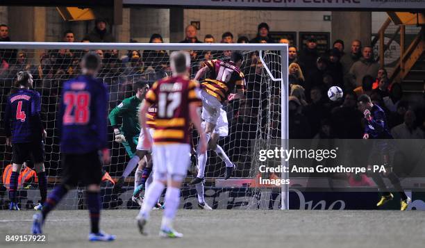 Arsenal's Thomas Vermaelen heads in his team's opening goal