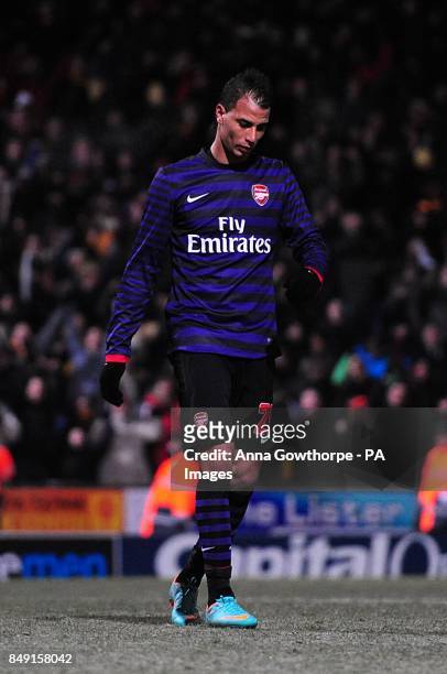 Arsenal's Marouane Chamakh reacts after missing his penalty
