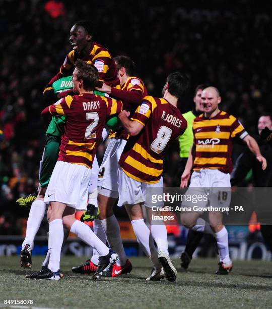 Bradford City players mob their goalkeeper Matt Duke as they celebrate after their victory after a penalty shoot out during the Capital One Cup,...