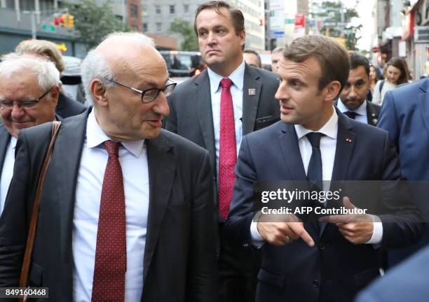 France's President Emmanuel Macron talks to his diplomatic adviser, Philippe Etienne, as they walk down 2nd Ave. On their way to the French mission...