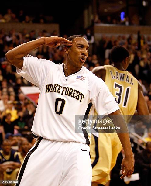 Jeff Teague of the Wake Forest Demon Deacons salutes fans after scoring a basket against the Georgia Tech Yellow Jackets during their game at...