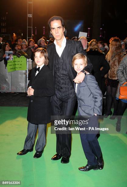 Nick Cave with his children Luke and Jethro arriving for the UK Premiere of The Hobbit: An Unexpected Journey at the Odeon Leicester Square, London.
