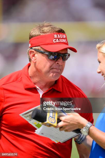 Louisiana-Lafayette Ragin Cajuns head coach Mark Hudspeth gives an interview during the college football game between the Louisiana Ragin' Cajuns and...