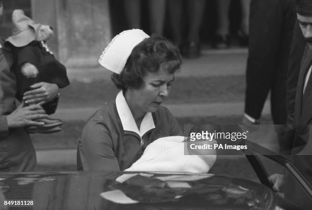 Princess Anne leaving the Lindo Wing of St Mary's Hospital, Paddington, with her two-day-old son Peter Phillips, who is carried by midwife Delphine...