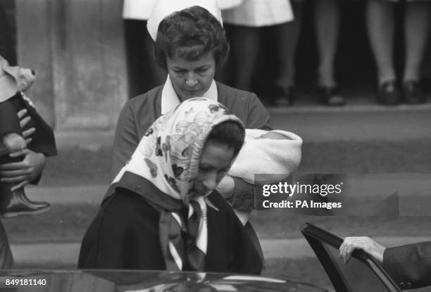 Princess Anne leaving the Lindo Wing of St Mary's Hospital, Paddington, with her two-day-old son Peter Phillips, who is carried by midwife Delphine...