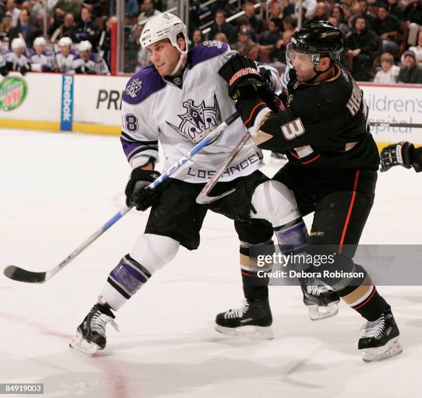 Jarret Stoll of the Los Angeles Kings fights for position against Bret Hedican of the Anaheim Ducks during the game on February 18, 2009 at Honda...