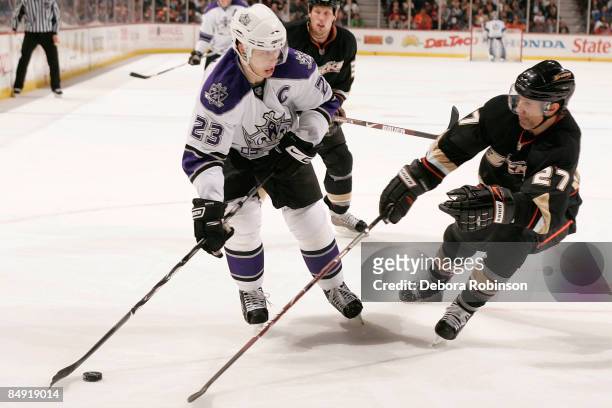 Dustin Brown of the Los Angeles Kings controls the puck against Scott Niedermayer of the Anaheim Ducks during the game on February 18, 2009 at Honda...